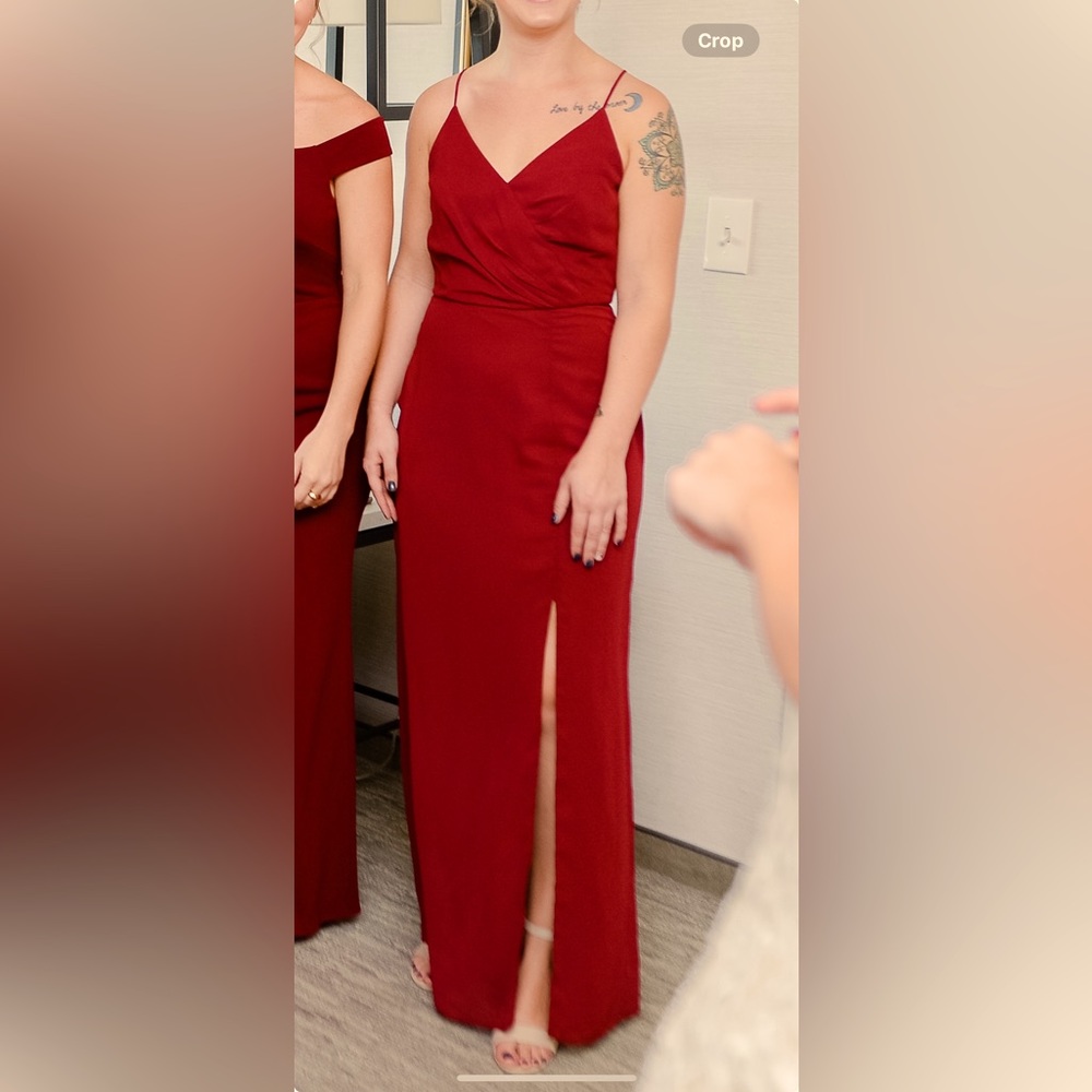 Burgundy gown backless with crisscross spaghetti straps in back.  Size 6